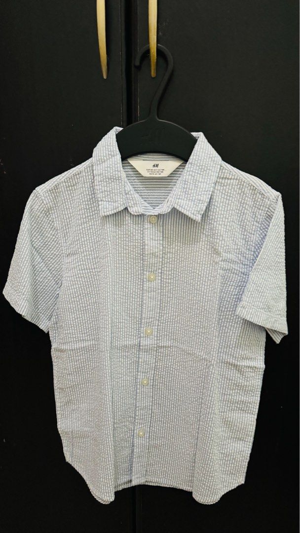 H&M Button down Short Sleeve Polo (Category: Babies & Kids Fashion) located in Lumban. Submitted by miloveditems (Listing ID 1387753488, Image 1). Description: Once used Like new 7-8yo on tag.