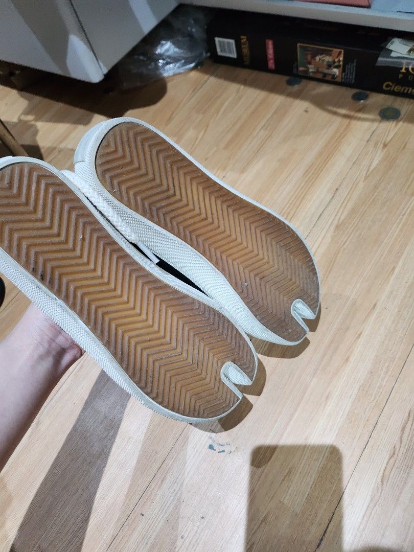 In between black tabi shoes (Category: Sneakers) located in Bulacan. Submitted by pintarest (Listing ID 1387809287, Image 3). Description: Changed the lace And on the last photo may crack but barely noticeable kapag suot na Super comfy Can fit 24cm.