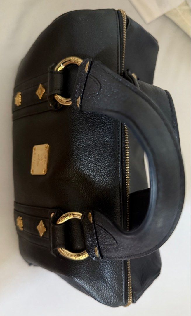 MCM black leather gold studded boston bag (Category: Luxury Bags & Wallets) located in Muntinlupa City. Submitted by bashabells (Listing ID 1387799048, Image 3). Description: Used only once and in excellent condition.
