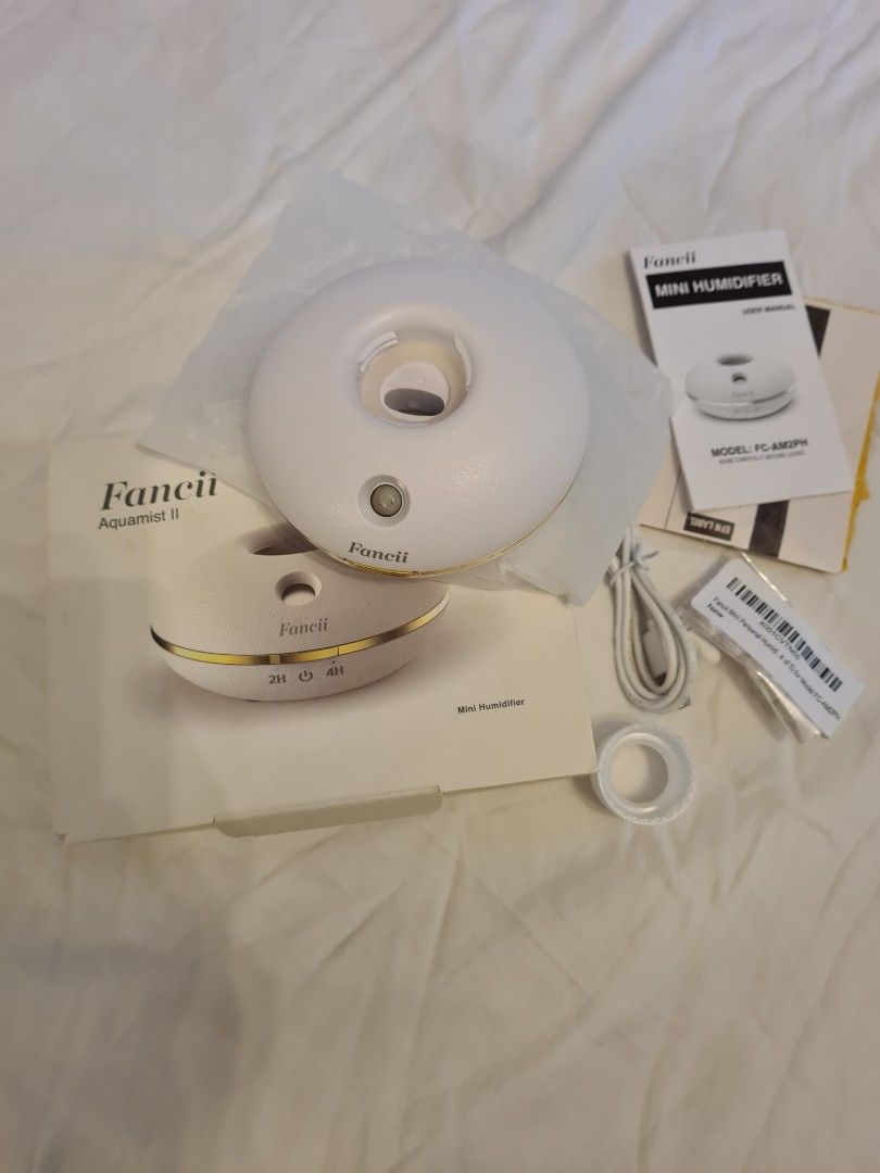 Mini Humidifier (Category: Other Gadgets) located in Taguig. Submitted by ninasanti94507 (Listing ID 1387743341, Image 1). Description: Fancii personal humidifier. Brand new and never used. To use, just plug on to USB and attach bottle with purified water. RFS: Decluttering Pick up from Taguig.