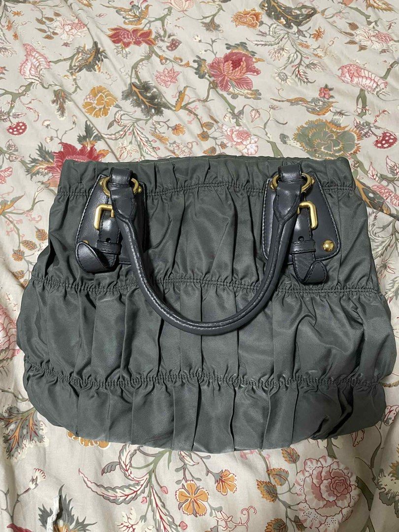 PRADA TESSUTO GAUFRE GREY GREEN BAG (Category: Luxury Bags & Wallets) located in Mandaluyong City. Submitted by dclutter.corner (Listing ID 1387871949, Image 3). Description: Inclusions: dust bag, strap, care booklet, authenticity card Dimensions: 34 cm (length) x 28cm (height) x 13 cm (width) x 15 cm (handle drop) x 41 - 46 cm (shoulder strap drop). Condition: Preloved, Good condition.