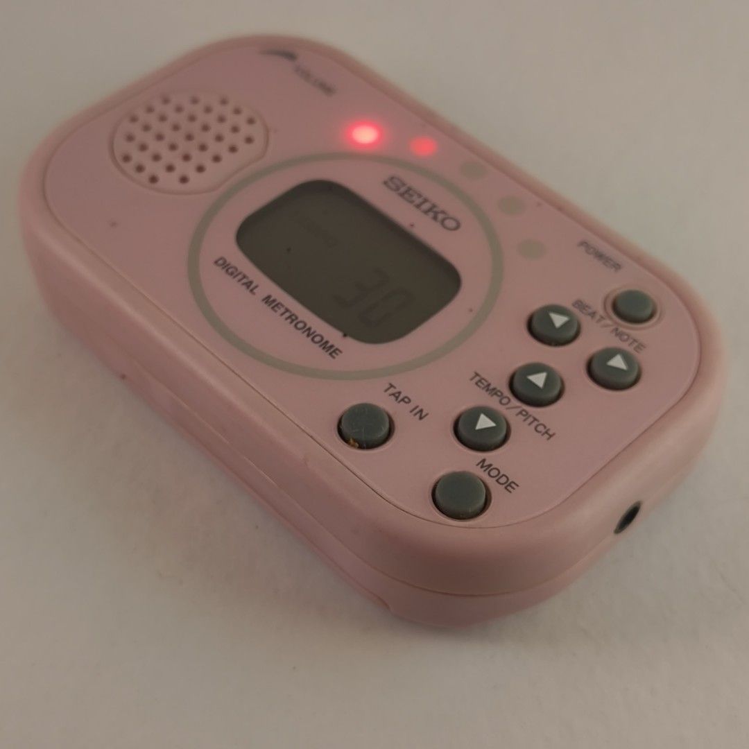 Seiko DM100 Pink Digital Metronome (Category: Musical Instruments) located in Taguig. Submitted by dandydane (Listing ID 1387841988, Image 3). Description: Digital Metronome 👍This is a multi-function digital metronome with a tap function. 👍It features a tempo range of 30 to 250 BPM and various beat patterns. 👍The tempo is visually indicated by five bright LEDs, making it suitable for various uses, including on-stage performances. 👍It includes