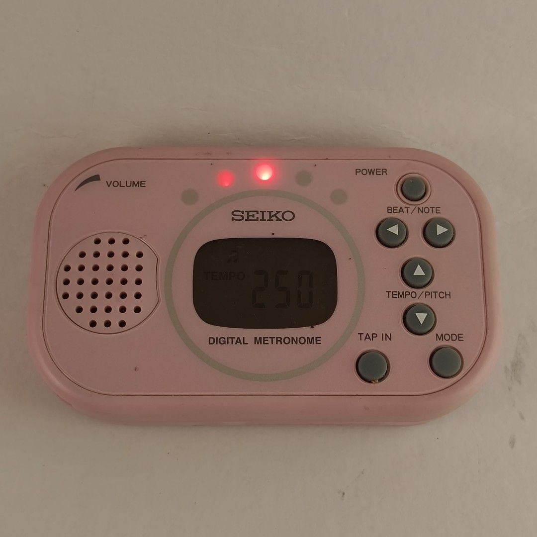 Seiko DM100 Pink Digital Metronome (Category: Musical Instruments) located in Taguig. Submitted by dandydane (Listing ID 1387841988, Image 2). Description: Digital Metronome 👍This is a multi-function digital metronome with a tap function. 👍It features a tempo range of 30 to 250 BPM and various beat patterns. 👍The tempo is visually indicated by five bright LEDs, making it suitable for various uses, including on-stage performances. 👍It includes