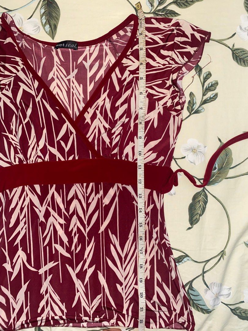 Y2k Wrap Around Top (Category: Blouses) located in Cavite. Submitted by bbbb444 (Listing ID 1387803398, Image 3). Description: super cute and form fitting !! bought from another carouseller! NO WW PHOTOS fits xs-s stretchable fabric worn once rfs: need money bahhddd.