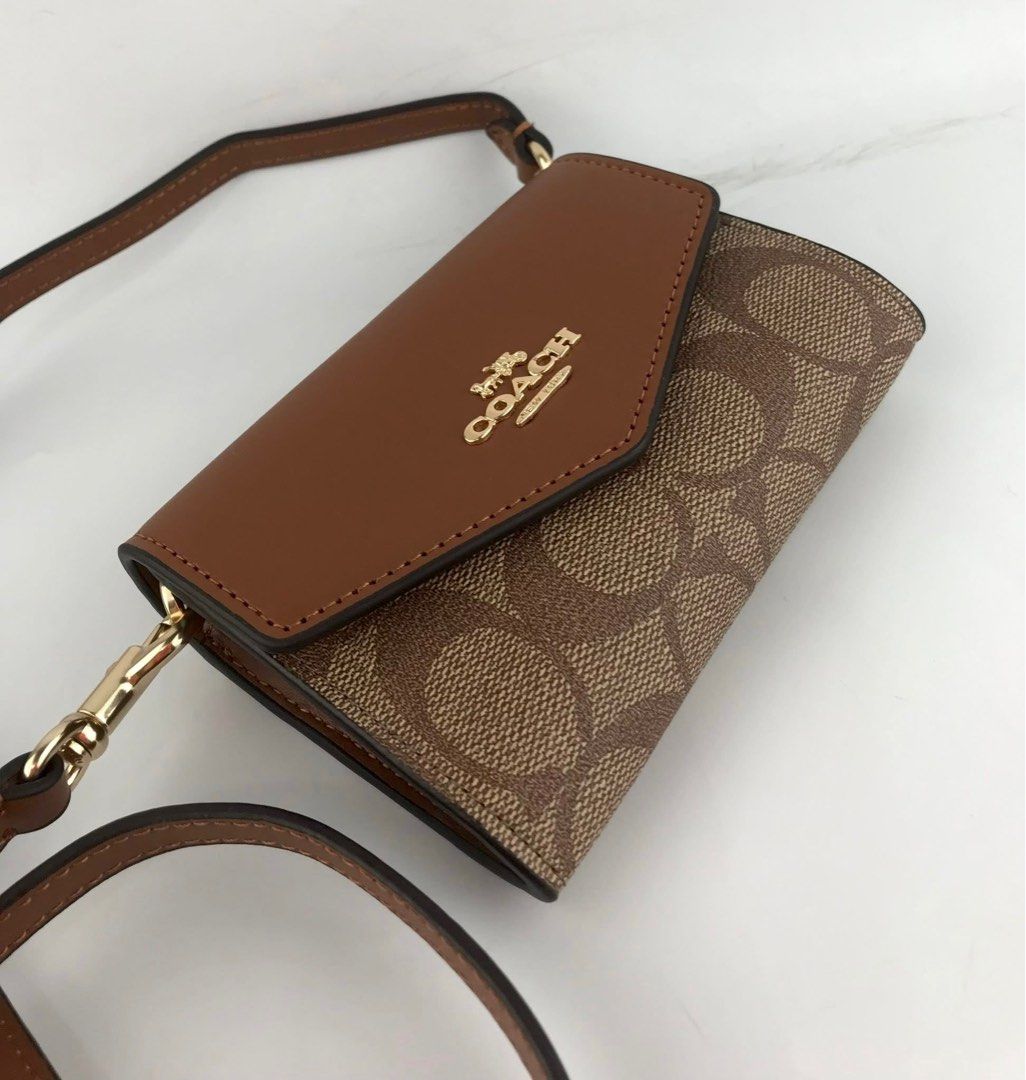 Coach Envelope Mini Sling Wallet (Category: Luxury Bags & Wallets) located in Las Pinas. Submitted by bagsnclothesby.j (Listing ID 1388001718, Image 2). Description: Brandnew with complete inclusions 💫 📩 DM for mode details! 🛵 Lalamove / J&T .