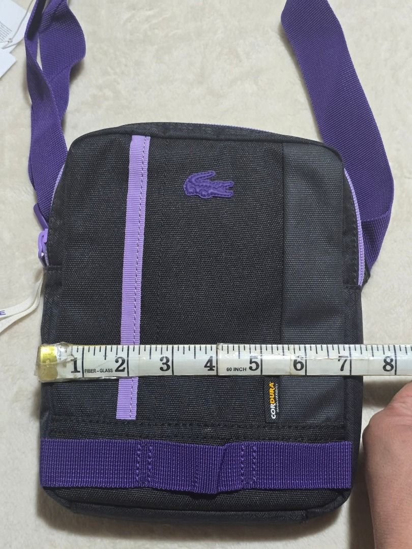Lacoste Vertical Camera Sling Bag (Brandnew) (Category: Camera Bags & Carriers) located in Santa Rosa. Submitted by omnicronzxc (Listing ID 1387972451, Image 2). Description: ₱ NOW 3,000 each add shipping J&T PO (5,950 SRP see price tag) 📌 Lacoste Sling Bag 🐊 Size : Width: 7.2 Length: 8.5 Depth: 1.5 COLOR: Black Violet Condition: BRAND NEW rate : 10/10.