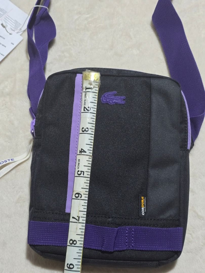 Lacoste Vertical Camera Sling Bag (Brandnew) (Category: Camera Bags & Carriers) located in Santa Rosa. Submitted by omnicronzxc (Listing ID 1387972451, Image 3). Description: ₱ NOW 3,000 each add shipping J&T PO (5,950 SRP see price tag) 📌 Lacoste Sling Bag 🐊 Size : Width: 7.2 Length: 8.5 Depth: 1.5 COLOR: Black Violet Condition: BRAND NEW rate : 10/10.