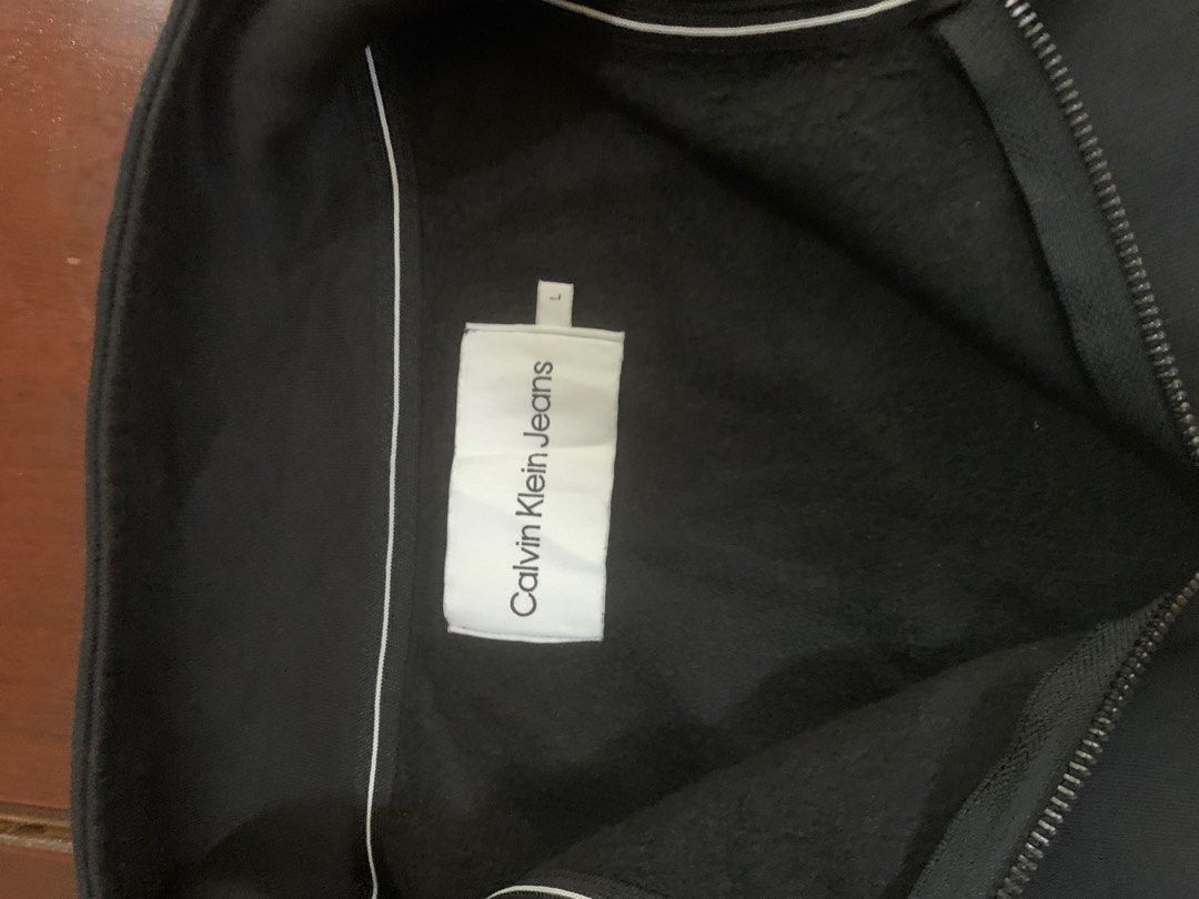 Oversized Style Calvin Klein Jeans Quarterzip Sweater (Category: Hoodies) located in Taguig. Submitted by saistars (Listing ID 1387978011, Image 3). Description: Calvin Klein Jeans Quarterzip Sweater like new condition very presentable Large on Tag — 24x29 in no issue.