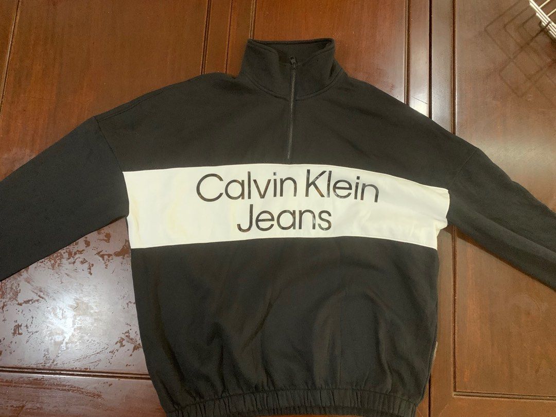 Oversized Style Calvin Klein Jeans Quarterzip Sweater (Category: Hoodies) located in Taguig. Submitted by saistars (Listing ID 1387978011, Image 1). Description: Calvin Klein Jeans Quarterzip Sweater like new condition very presentable Large on Tag — 24x29 in no issue.