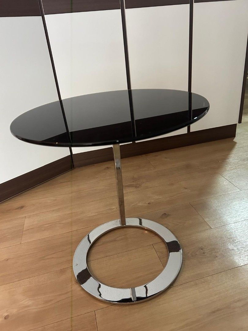 Side table (Category: Other Home Furniture) located in Singapore. Submitted by cllll03 (Listing ID 1388117261, Image 2). Description: Moderen round side coffee table for sale. Glass top, steel (glossy finish) stand (abit tarnish),still in good working condition.