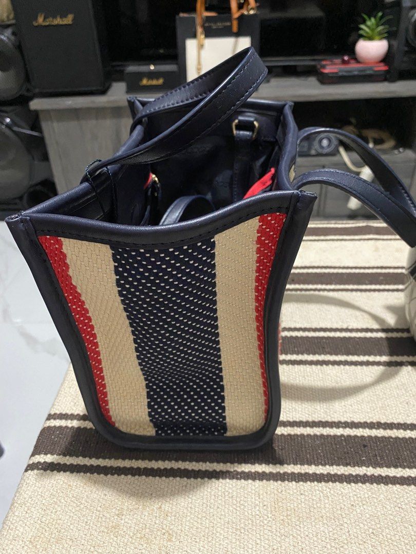 TH sling bag (Category: Luxury Bags & Wallets) located in Santiago. Submitted by shoppaholickikay (Listing ID 1388094533, Image 3). Description: With long straps.