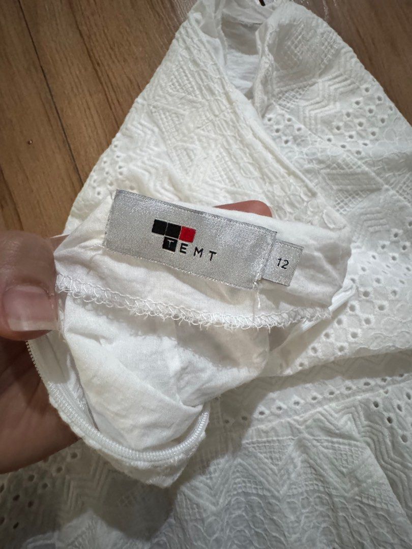 TEMT White Skirt with Eyelet design (Category: Skirts) located in Quezon City. Submitted by decluttrqueen (Listing ID 1387956025, Image 3). Description: White skirt with eyelet design and ruffled hem Length: 18 inches Waisline: 29-30 inches TEMT (Australian Brand) RFS: Not being used.