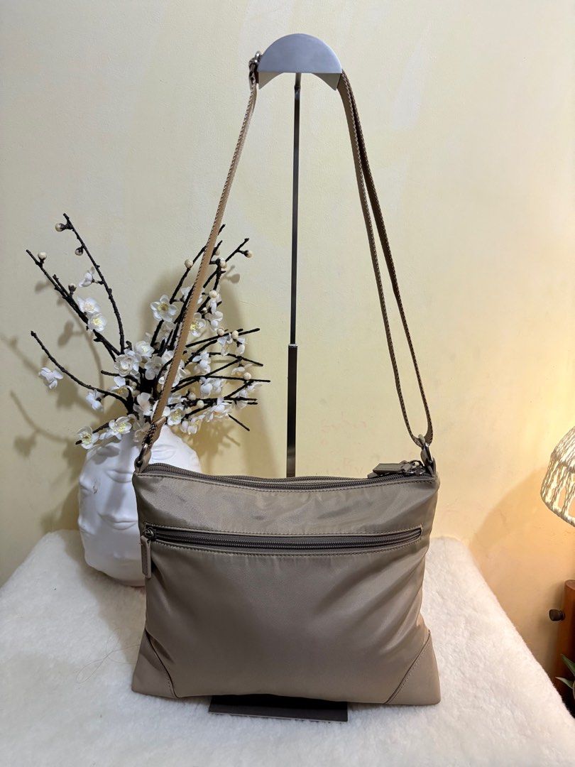 Authentic Ungaro Sling Bag / Crossbody Bag (Category: Luxury Bags & Wallets) located in Binangonan. Submitted by makoleksyon (Listing ID 1388124380, Image 3). Description: Excellent condition Like new No flaws Bought in Japa Heavy Duty Nylon and leather material like prada Ganda nito daming zipper compartment .