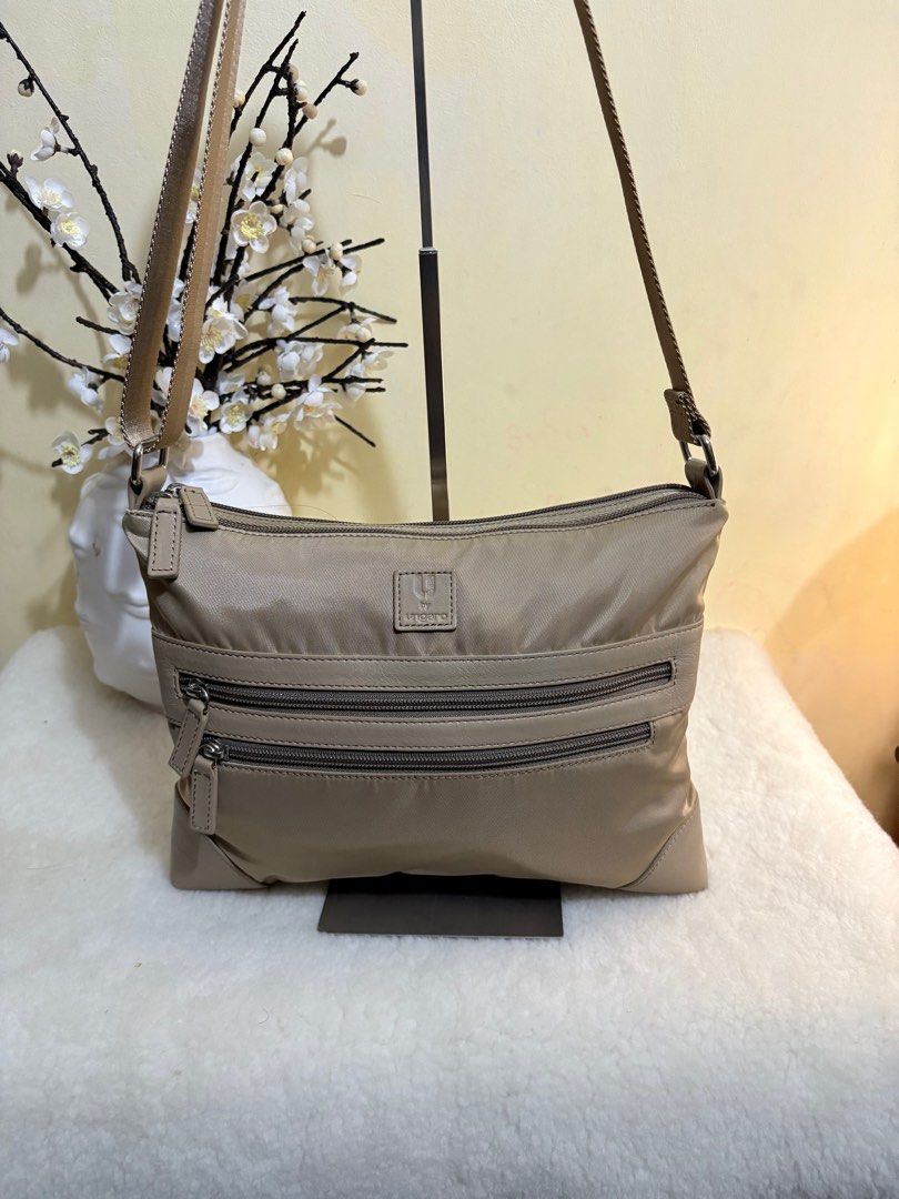 Authentic Ungaro Sling Bag / Crossbody Bag (Category: Luxury Bags & Wallets) located in Binangonan. Submitted by makoleksyon (Listing ID 1388124380, Image 2). Description: Excellent condition Like new No flaws Bought in Japa Heavy Duty Nylon and leather material like prada Ganda nito daming zipper compartment .