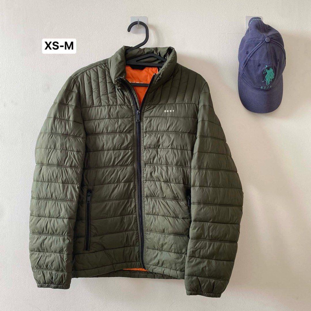 DKNY Water Resistant Ultra Loft Quilted Packable Puffer Jacket Down Alternative Coat (Category: Coats, Jackets and Outerwear) located in Quezon City. Submitted by madisonred (Listing ID 1388232483, Image 1). Description: • Decluttering • Bought in the US • Well used • 8/10 condition • Has minor flaws (The brand name on the jacket is starting to peel off).