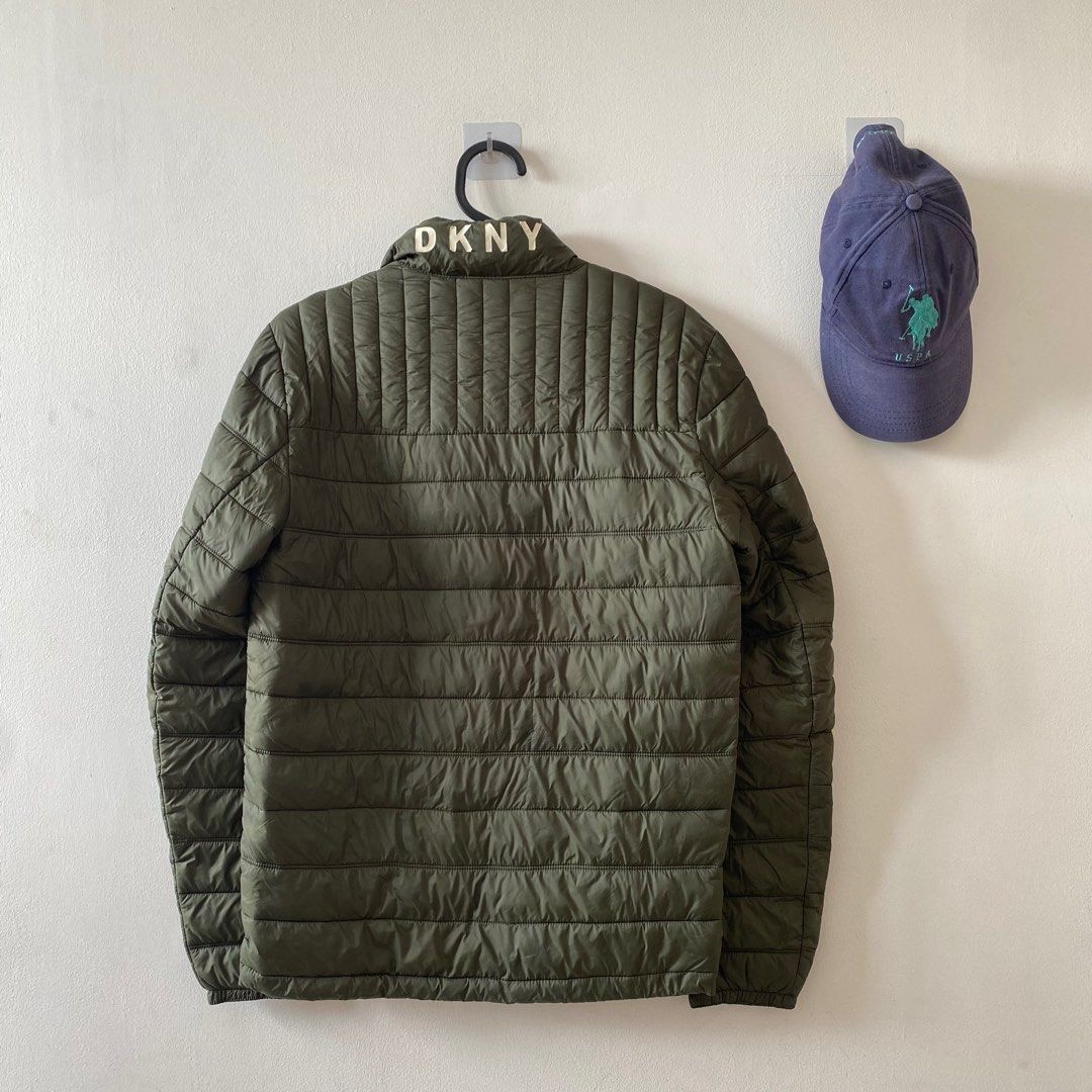 DKNY Water Resistant Ultra Loft Quilted Packable Puffer Jacket Down Alternative Coat (Category: Coats, Jackets and Outerwear) located in Quezon City. Submitted by madisonred (Listing ID 1388232483, Image 2). Description: • Decluttering • Bought in the US • Well used • 8/10 condition • Has minor flaws (The brand name on the jacket is starting to peel off).