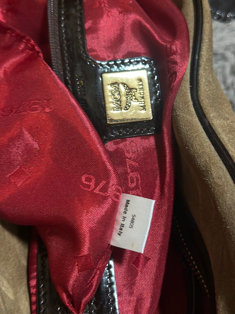 MCM Boston/Duffle Bag (Category: Luxury Bags & Wallets) located in Quezon City. Submitted by donaya_luxe (Listing ID 1388291577, Image 3). Description: Body of the bag is a Suede Material while the handles and other linings is patent leather Since this is a vintage bag ,the suede shows signs of usage & dirt which can be cleaned. Flaws are shown in the pics for your reference Overall this bag is presentable .