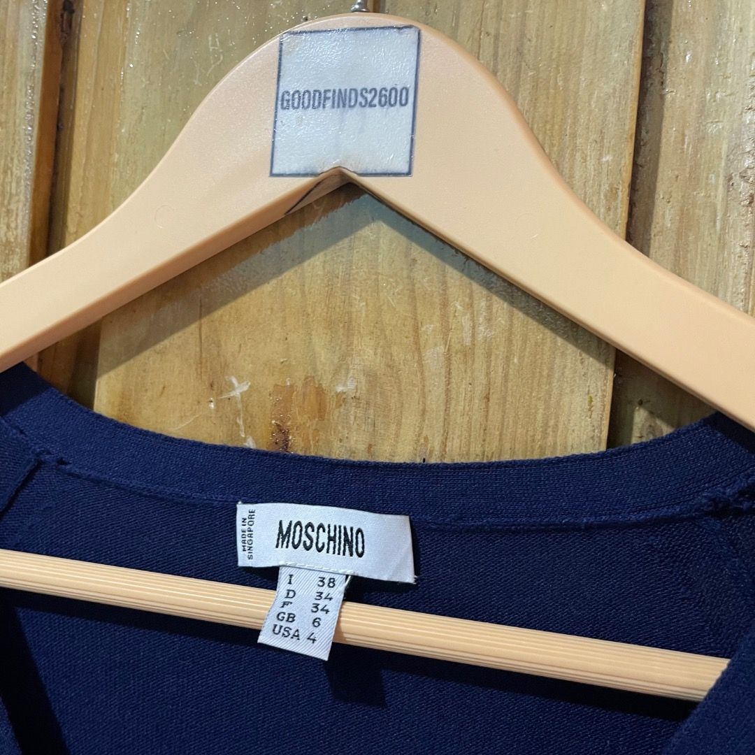 Moschino Button Knitted Dress (Category: Luxury Apparel) located in Baguio. Submitted by goodfinds2600v2 (Listing ID 1388208716, Image 3). Description: Size: 38 on tag fits M-L Dimensions: L-31 W-14.5 Description: womens Condition: Excellent Issue: —.