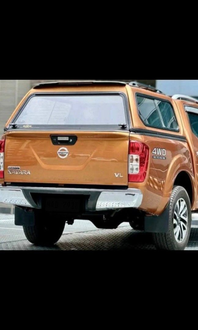 Nissan Navara Canopy Campershell (Category: Body Parts and Accessories) located in Quezon City. Submitted by marky0306 (Listing ID 1388173630, Image 2). Description: Negotiable Very Good Condition 9/10 Savana Orange color With windows on each side and front With 2 locks and keys-very safe With 3rd Eye Brakelight No water leak RFS: change to open bed.