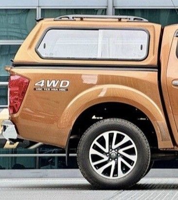 Nissan Navara Canopy Campershell (Category: Body Parts and Accessories) located in Quezon City. Submitted by marky0306 (Listing ID 1388173630, Image 3). Description: Negotiable Very Good Condition 9/10 Savana Orange color With windows on each side and front With 2 locks and keys-very safe With 3rd Eye Brakelight No water leak RFS: change to open bed.