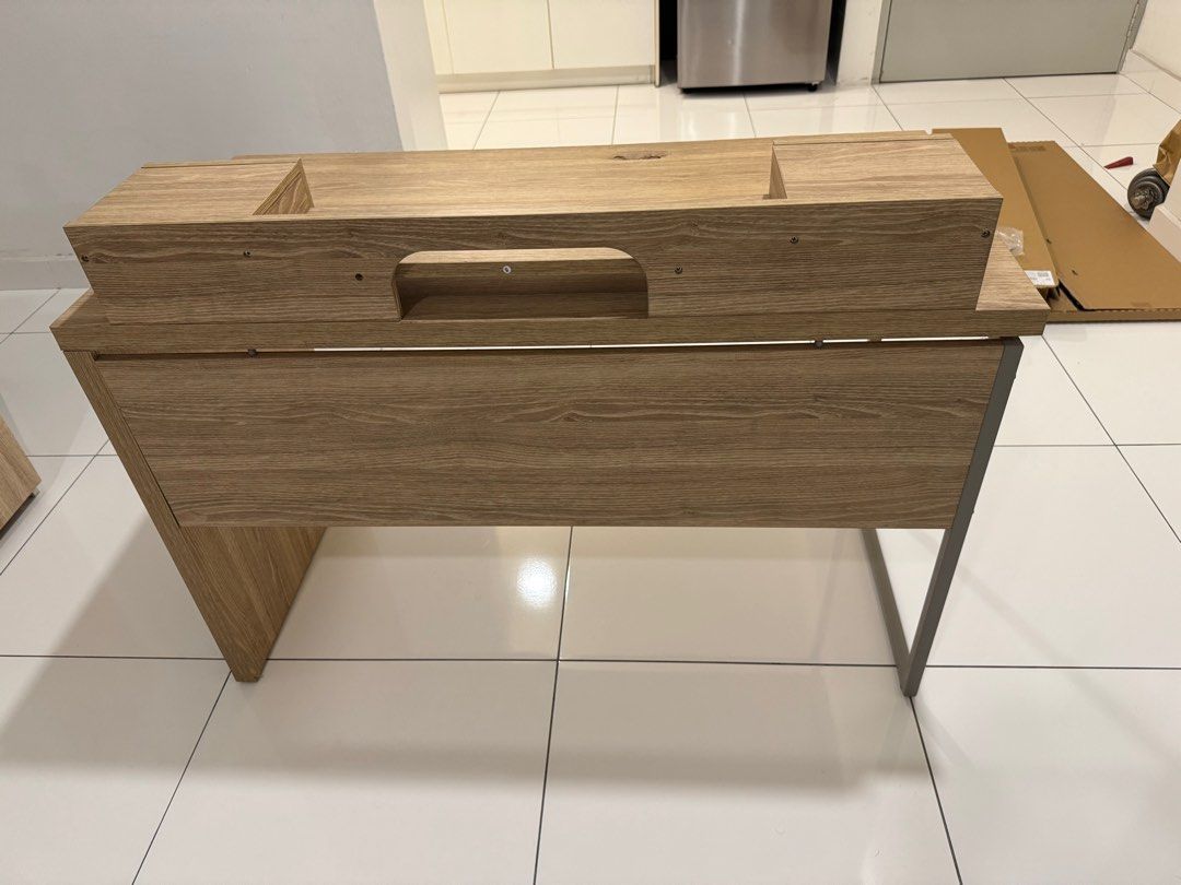 Study / Computer Desk (Category: Tables & Sets) located in Johor Bahru. Submitted by THTUV (Listing ID 1388189270, Image 3). Description: For sale is a used computer or study desk. It is 120cm (L) X 60cm (W) X 75cm (H). Please take note on the defect on the table top, there is a hole that was caused by depression from my elbow. Self collection only, as im not sure how to get it shipped. Price negotiable. Thanks for viewing. .