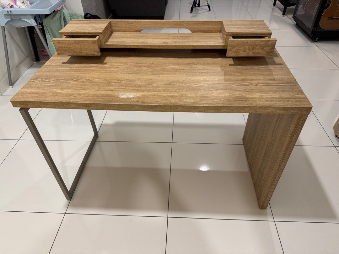 Study / Computer Desk (Category: Tables & Sets) located in Johor Bahru. Submitted by THTUV (Listing ID 1388189270, Image 2). Description: For sale is a used computer or study desk. It is 120cm (L) X 60cm (W) X 75cm (H). Please take note on the defect on the table top, there is a hole that was caused by depression from my elbow. Self collection only, as im not sure how to get it shipped. Price negotiable. Thanks for viewing. .