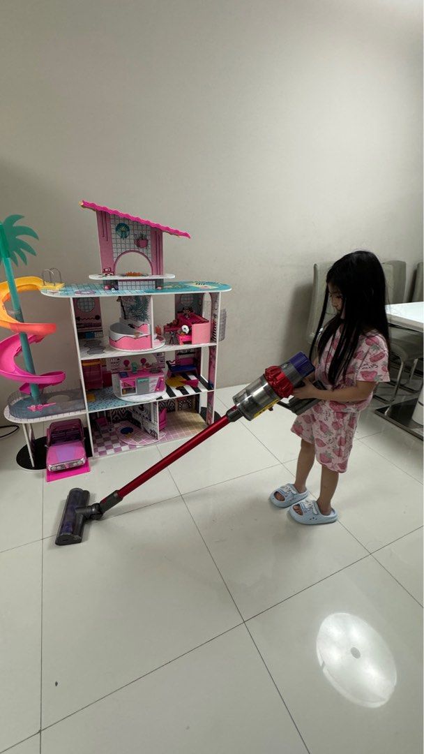 LOL Surprise OMG House (Category: Kids Toys) located in Taguig. Submitted by lalohan (Listing ID 1388310112, Image 3). Description: 81.28 x 21.59 x 67.95 cm; 500 g MADE FROM REAL SUSTAINABLE WOOD; THIS HOUSE MEASURES 122CM TALL BY 122CM WIDE FEATURING 4 STORIES AND 9 PLAY AREAS INCLUDING A LIVING ROOM; POOL; ROOFTOP PATIO; DINER; AND MORE! FULLY FURNISHED. A FULLY EQUIPPED KITCHEN CABINET; A FRIDGE STOCKED WITH TONS OF FOOD ACCESSORIES; TRANSFORM