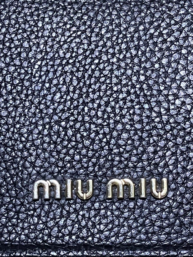 Miu Miu Wallet on Chain (Category: Luxury Bags & Wallets) located in Rosario. Submitted by myvinatgepieces (Listing ID 1388424647, Image 2). Description: Miu Miu Wallet on Chain Crafted with black grained leather Multi Card slots Flap Closure One Zipper Compartment Excellent Used Condition With Minor Sign of Wear No Other Inclusions Selling as is.