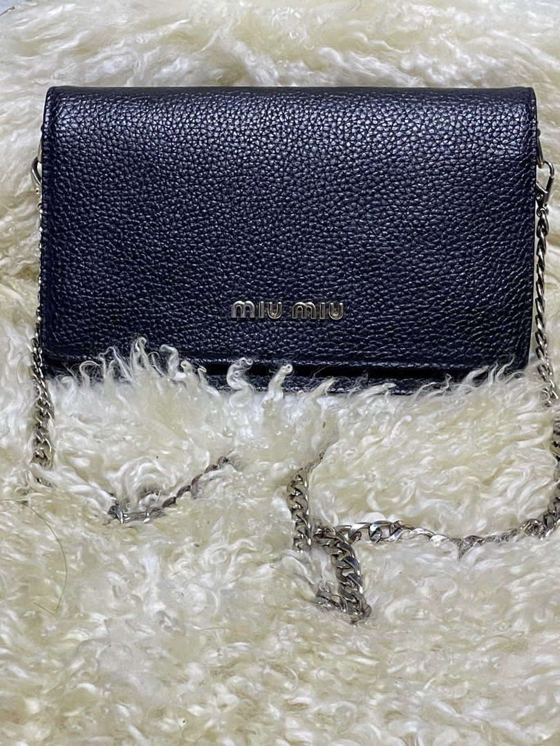 Miu Miu Wallet on Chain (Category: Luxury Bags & Wallets) located in Rosario. Submitted by myvinatgepieces (Listing ID 1388424647, Image 1). Description: Miu Miu Wallet on Chain Crafted with black grained leather Multi Card slots Flap Closure One Zipper Compartment Excellent Used Condition With Minor Sign of Wear No Other Inclusions Selling as is.