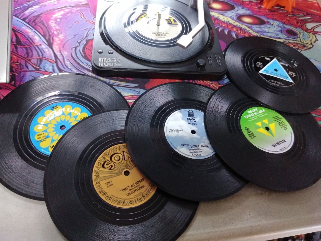 Novelty Vinyl Coasters (Category: Coffee & Tea Tableware) located in Las Pinas. Submitted by hppyclttrc0. (Listing ID 1388343821, Image 3). Description: -These coasters are designed to look like vinyl records and come with a holder resembling a record player. -Very decorative and ideal gift for music lovers. Can add a nostalgic touch to any setting. -Box included [Packaging has tears/dents/creases, but item itself is unused and in perfect conditi