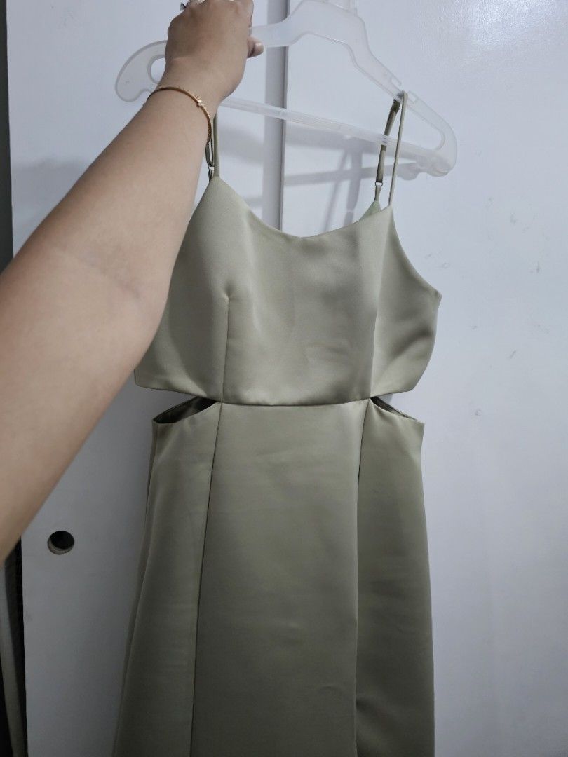 Sage Green Long Gown with side slit (Category: Evening dresses & gowns) located in Quezon City. Submitted by jayjiess (Listing ID 1388445019, Image 2). Description: Size: Large Measurements laid flat: Bust: 17in Waist: 15in Length (from waist to hem): 40in - bought brand new, used once for a wedding - with cut out detail on sides - side slit positioned by left thigh - strap adjustible - see 6th pic for a super minor flaw (visible only when close 
