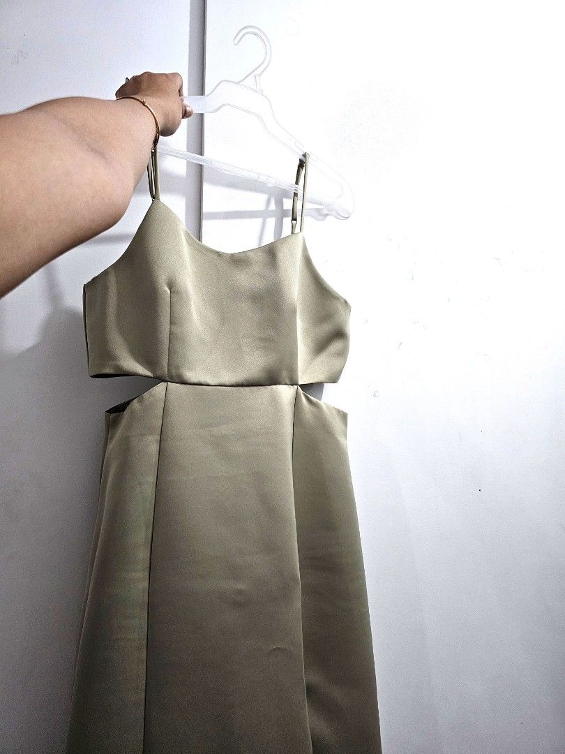 Sage Green Long Gown with side slit (Category: Evening dresses & gowns) located in Quezon City. Submitted by jayjiess (Listing ID 1388445019, Image 1). Description: Size: Large Measurements laid flat: Bust: 17in Waist: 15in Length (from waist to hem): 40in - bought brand new, used once for a wedding - with cut out detail on sides - side slit positioned by left thigh - strap adjustible - see 6th pic for a super minor flaw (visible only when close 