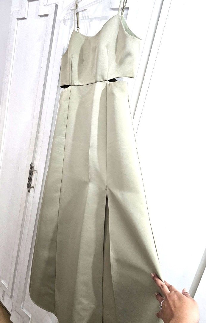 Sage Green Long Gown with side slit (Category: Evening dresses & gowns) located in Quezon City. Submitted by jayjiess (Listing ID 1388445019, Image 3). Description: Size: Large Measurements laid flat: Bust: 17in Waist: 15in Length (from waist to hem): 40in - bought brand new, used once for a wedding - with cut out detail on sides - side slit positioned by left thigh - strap adjustible - see 6th pic for a super minor flaw (visible only when close 