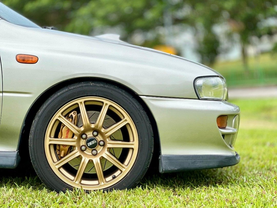 Subaru GC8 Impreza WRX 2.0 Manual Manual (Category: Used Cars) located in Singapore. Submitted by hockyboy (Listing ID 1388369419, Image 2). Description: Ultra Rare Subaru GC8 for sale, Strong EJ20, JDM STI 6 Speed Manual with DCCD. Under carriage - Spec C front arms & S204 rear arms mated with 3 way AST coilover suspension, pillow ball mounts all round for better feel, grip & handling. Gold BBS Rims with matching STI Brembo Gold brake calipers a
