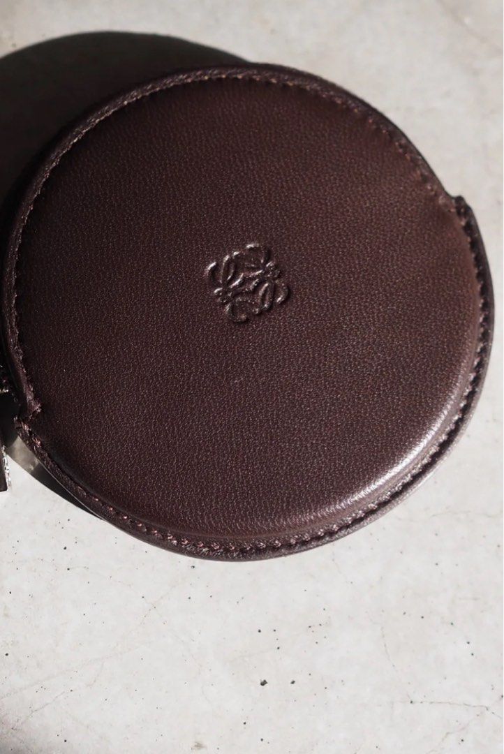 Vintage Loewe Coin Purse (Category: Luxury Bags & Wallets) located in Rosario. Submitted by myvinatgepieces (Listing ID 1388444028, Image 1). Description: Vintage Loewe Coin Purse circa 1990-2000 brown color lambskin signature debossed Anagram motif top zip fastening Good Used Condition With Visible Signs of wear.