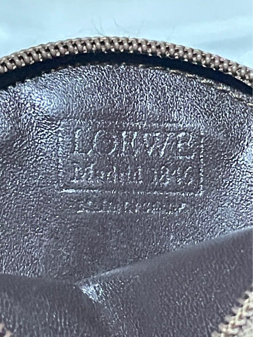 Vintage Loewe Coin Purse (Category: Luxury Bags & Wallets) located in Rosario. Submitted by myvinatgepieces (Listing ID 1388444028, Image 3). Description: Vintage Loewe Coin Purse circa 1990-2000 brown color lambskin signature debossed Anagram motif top zip fastening Good Used Condition With Visible Signs of wear.