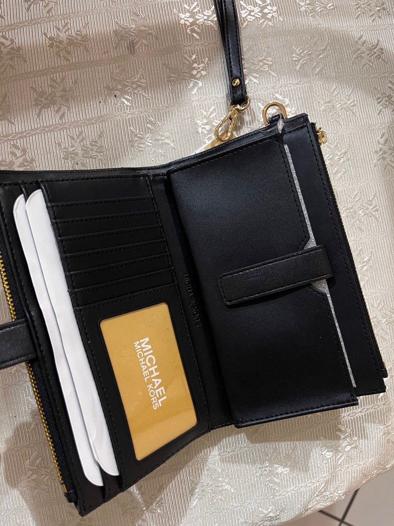 Authentic Michael Kors Peyton Double Zip wristlet (Category: Other Accessories) located in Quezon City. Submitted by psc2nd (Listing ID 1388582366, Image 2). Description: This is an Authentic Michael Kors Peyton Double zip Wristlet quilted Material Black Hardwares are in Gold double zip pockets 1 phone pocket 7 card slot 2 wide multifunctional pockets This i brand new but will flaw. Original was $228… We are selling this aa a very low price becau