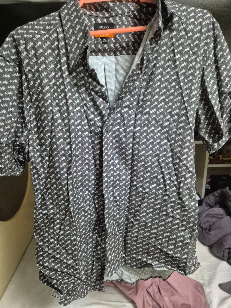 Code Grey Patterned Shirt (Category: Tshirts & Polo Shirts) located in Singapore. Submitted by dimedealz (Listing ID 1388683230, Image 1). Description: - Stylish grey patterned shirt - Good condition - Versatile for casual or semi-formal events - Refer to images for details.