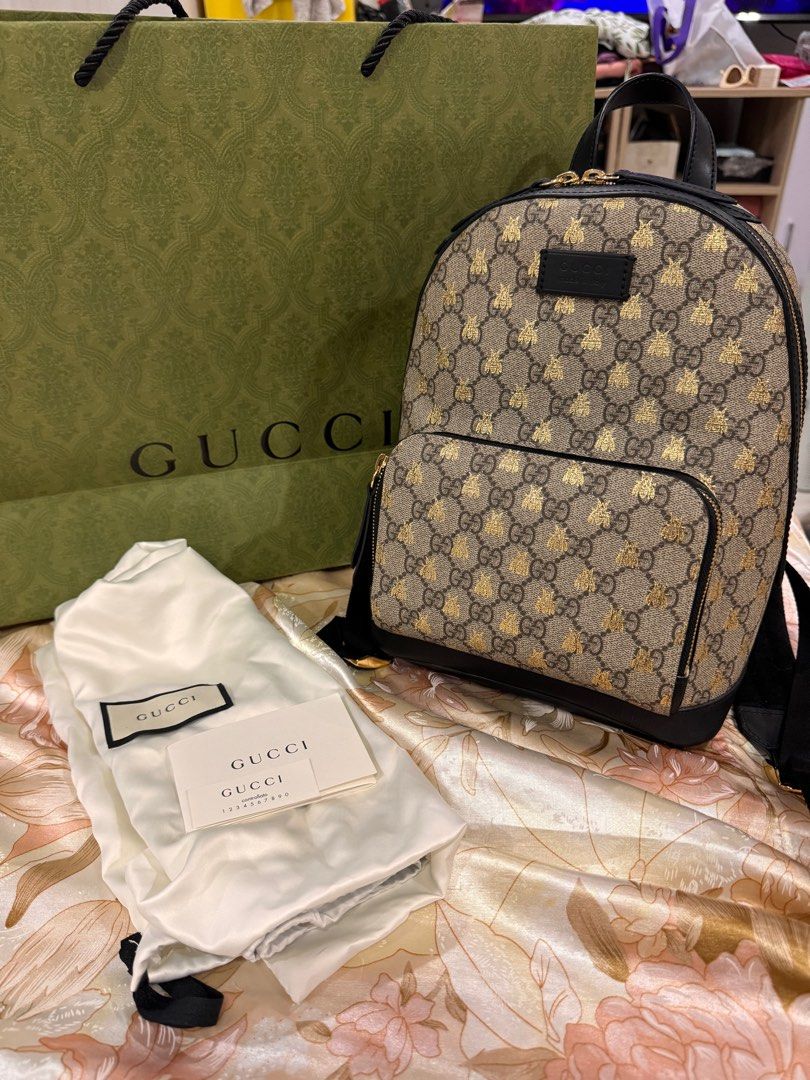 Gucci backpack (Category: Luxury Bags & Wallets) located in Manila. Submitted by happylvoe (Listing ID 1388687255, Image 2). Description: Authentic Gucci Brown and Gold GG Supreme Monogram Bees Small Day Backpack Gold Hardware. - lined with beige microfiber -Includes care booklet, dust bag all in good condition Dimensions: Height: 11.81 inches / 30 cm Width: 8.66 inches / 22 cm Depth: 4.72 inches / 12 cm .