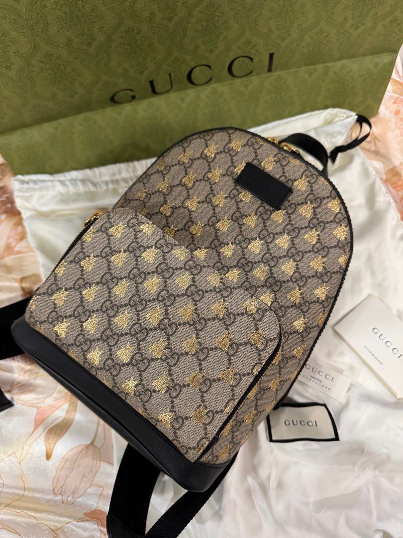 Gucci backpack (Category: Luxury Bags & Wallets) located in Manila. Submitted by happylvoe (Listing ID 1388687255, Image 1). Description: Authentic Gucci Brown and Gold GG Supreme Monogram Bees Small Day Backpack Gold Hardware. - lined with beige microfiber -Includes care booklet, dust bag all in good condition Dimensions: Height: 11.81 inches / 30 cm Width: 8.66 inches / 22 cm Depth: 4.72 inches / 12 cm .