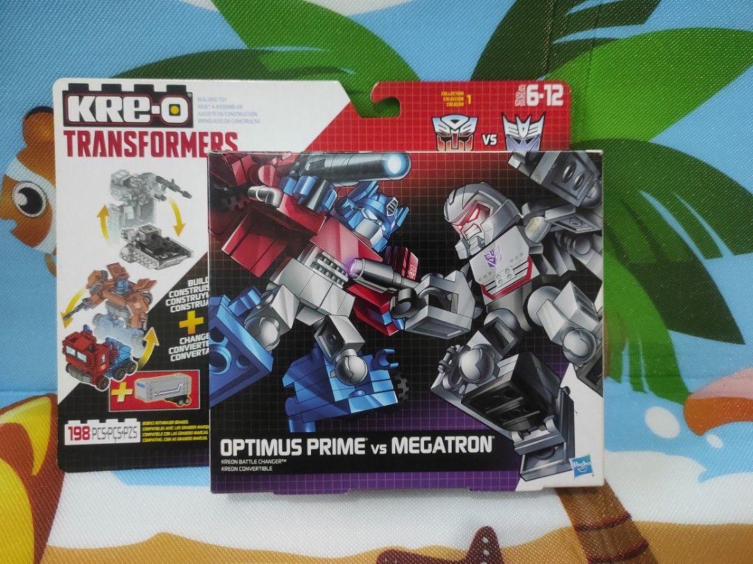 Kre-O Transformers Optimus Prime vs Megatron (Category: Lego & Building Sets) located in Quezon City. Submitted by mjp918557503 (Listing ID 1388609092, Image 1). Description: Kre-O Transformers Optimus Prime vs Megatron Complete set (Items in Very Good Conditions) - Manual - Sticker (Never Used) - Optimus Prime - Megatron.