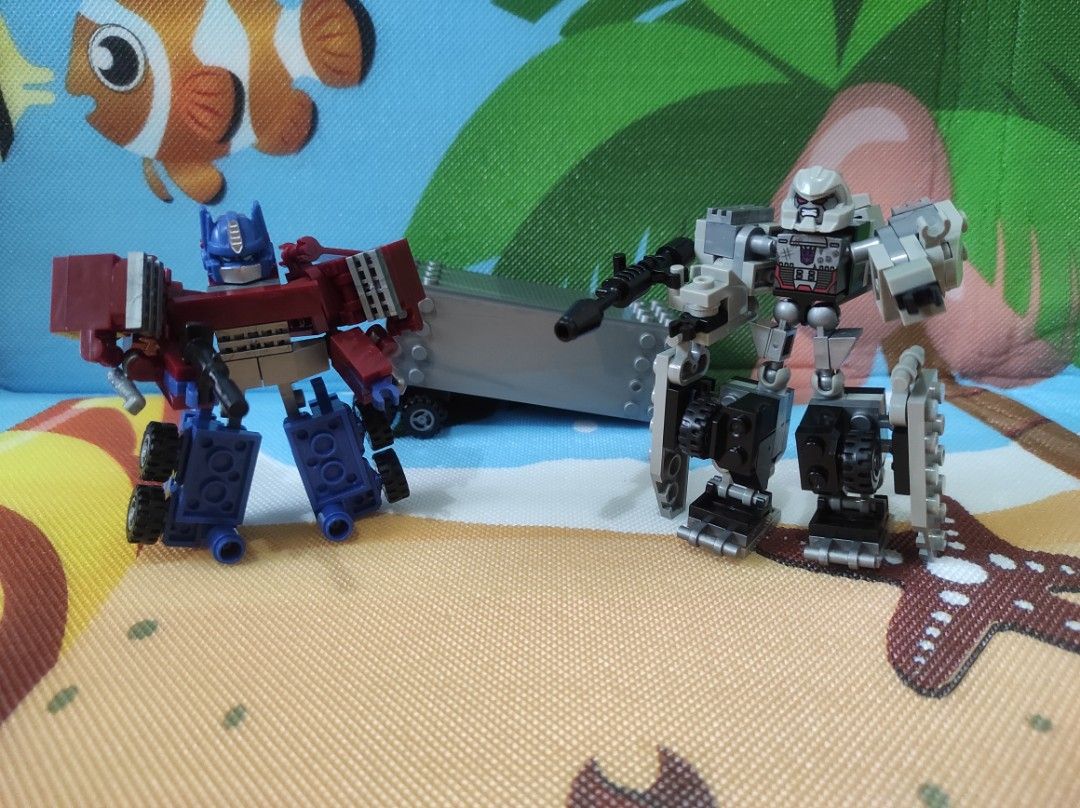 Kre-O Transformers Optimus Prime vs Megatron (Category: Lego & Building Sets) located in Quezon City. Submitted by mjp918557503 (Listing ID 1388609092, Image 3). Description: Kre-O Transformers Optimus Prime vs Megatron Complete set (Items in Very Good Conditions) - Manual - Sticker (Never Used) - Optimus Prime - Megatron.