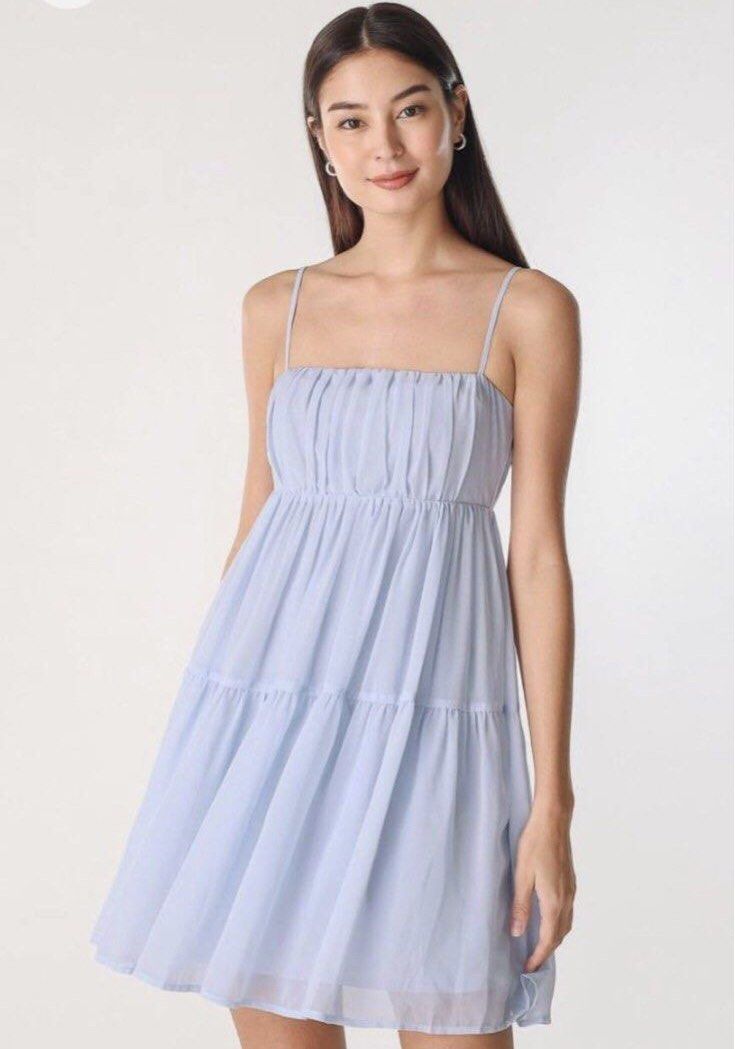 LOVET LYNN RUCHED TIERED DRESS (ANGEL BLUE) (Category: Dresses) located in Singapore. Submitted by starryclover_ (Listing ID 1388586291, Image 1). Description: - Adorable light blue mini dress - Features a tiered skirt - Delicate spaghetti straps - Made of lightweight, flowy fabric - Flattering fit - Perfect for casual outings or dressing up.