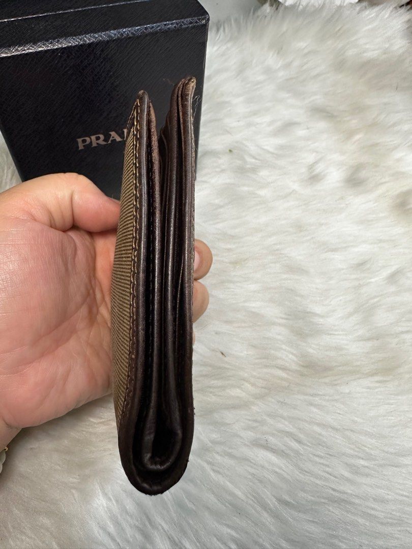 prada men's wallet (Category: Luxury Bags & Wallets) located in Antipolo. Submitted by ambercs (Listing ID 1388522789, Image 3). Description: auth prada mens wallet preloved with minor signs of usage minor rubs can be retouch naman cleaning slightly needed if maselan 2 bill compartment 4-5 card slots 1 coin slot.
