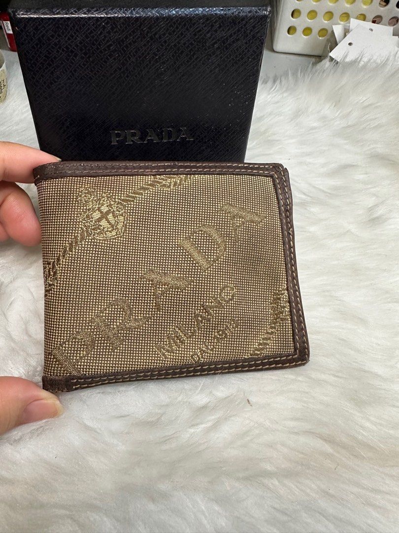 prada men's wallet (Category: Luxury Bags & Wallets) located in Antipolo. Submitted by ambercs (Listing ID 1388522789, Image 1). Description: auth prada mens wallet preloved with minor signs of usage minor rubs can be retouch naman cleaning slightly needed if maselan 2 bill compartment 4-5 card slots 1 coin slot.