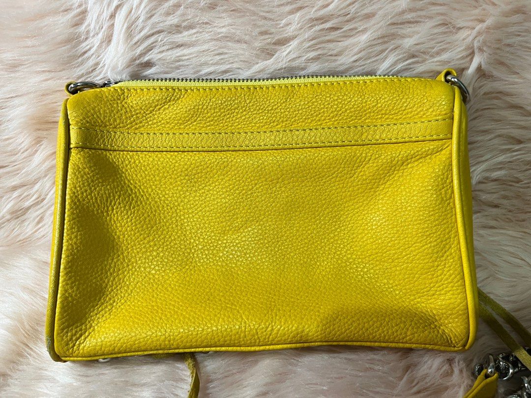 Rebecca Minkoff cross body bag (Category: Cross-body Bags) located in Pasig City. Submitted by jacq0301 (Listing ID 1388554234, Image 2). Description: Rebecca Minkoff yellow cross body bag Heavily used Needs cleaning Hardware still in good condition Perfect for casual events or going to the mall for a pop of color .
