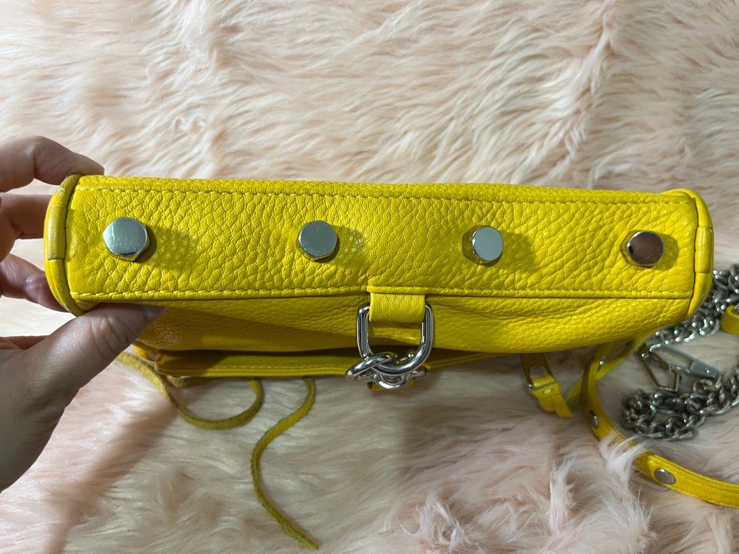 Rebecca Minkoff cross body bag (Category: Cross-body Bags) located in Pasig City. Submitted by jacq0301 (Listing ID 1388554234, Image 3). Description: Rebecca Minkoff yellow cross body bag Heavily used Needs cleaning Hardware still in good condition Perfect for casual events or going to the mall for a pop of color .