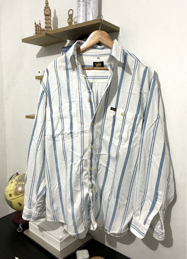 Lee blue stripes longsleeves (Category: Formal Shirts) located in Manila. Submitted by 888declutters (Listing ID 1388678612, Image 1). Description: Good as new M on tag but fits L to XL Old money style fit see pics for details helping tags: Vintage button down, blue stripes button down, blue striped button down, white and blue long sleeves, Lee button down, old money top.