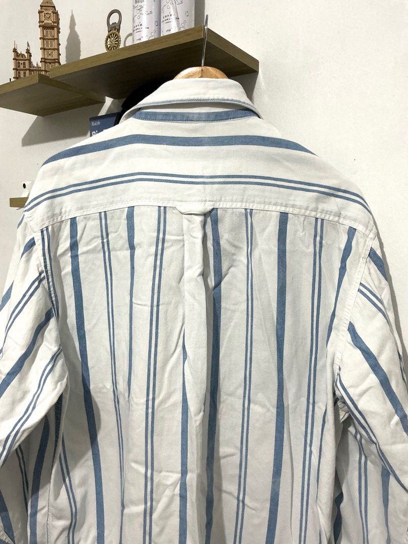 Lee blue stripes longsleeves (Category: Formal Shirts) located in Manila. Submitted by 888declutters (Listing ID 1388678612, Image 3). Description: Good as new M on tag but fits L to XL Old money style fit see pics for details helping tags: Vintage button down, blue stripes button down, blue striped button down, white and blue long sleeves, Lee button down, old money top.