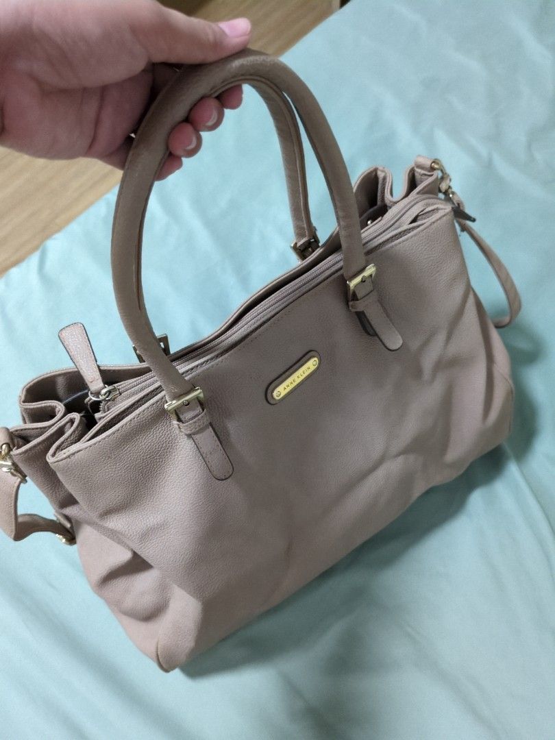 Anne Klein Leather Bag (Category: Shoulder Bags) located in Mandaluyong City. Submitted by bbcatham (Listing ID 1388834044, Image 1). Description: Authentic Anne Klein Leather bag from UAE With 2 compartments (very spacious) with 2 inner pockets Can be used as a handbag or sling with strap No flaws like scratches or pen marks Love this so much lalo na the color like mocha Width: 14-16in Length: 11in Bottom: 4in.